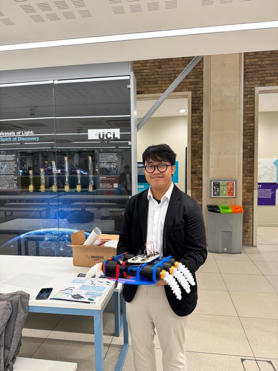 Rayang holding the finished soft underwater robot prototype at UCL
